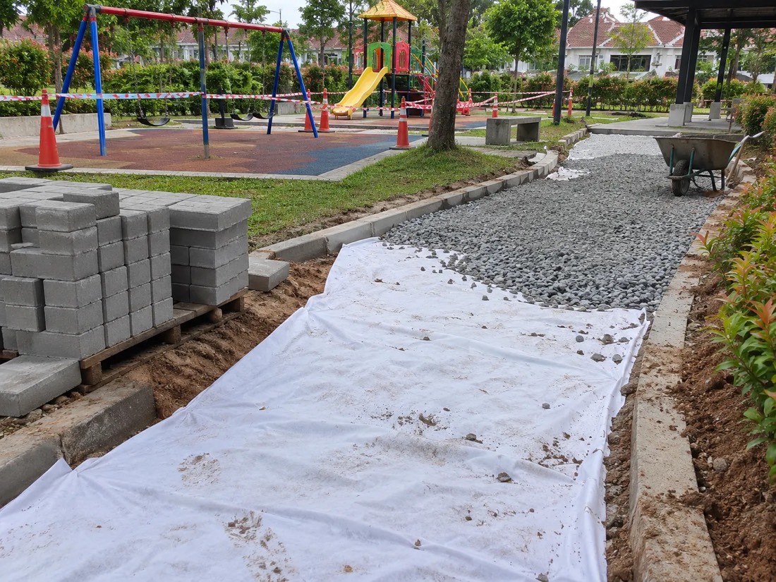 AeroTex under the stone bed of a paver walkway beside a playground